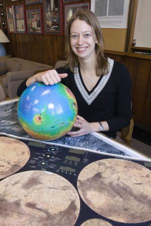 Found: Elusive Martian Mineral - Brown University graduate student Bethany Ehlmann found the elusive mineral carbonate on Mars, bolstering the chances that life may have existed on the red planet and evidence of primitive forms may remain.